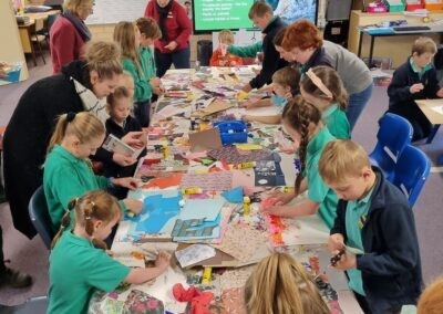 Children gathered around listening to Kathleen